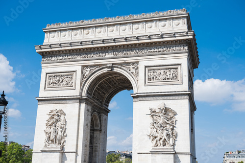 Arc de Triomphe, one of the most famous monuments in Paris, massive triumphal arch, located near Champs-Elysees in Paris. Close up, selective focus © Liliya Trott
