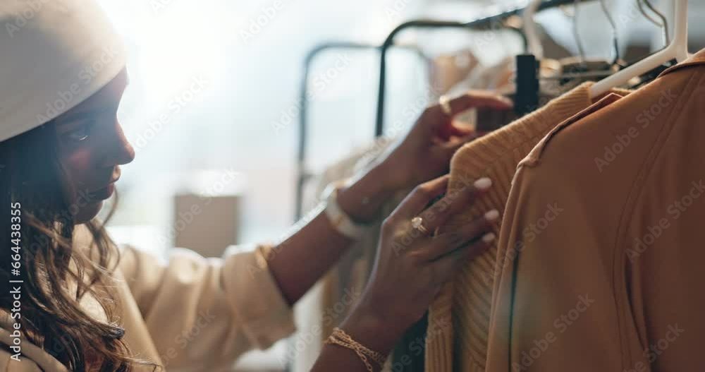 Sale, shopping and Indian woman with clothes, search or outfit choice at boutique or thrift store. Fashion, decision and female customer looking for discount, deal or checking fabric quality at mall