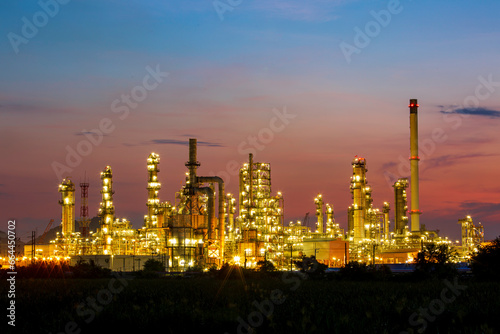 Oil​ refinery​ and​ plant and tower column of Petrochemistry industry in oil​ and​ gas​ ​industrial with​ cloud​ red sky