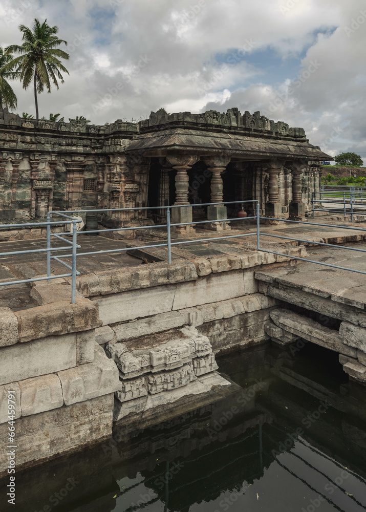 Manikeshwar Temple, Lakkundi. India. Trikuta temple with one of the many historical stepwells at Lakkundi