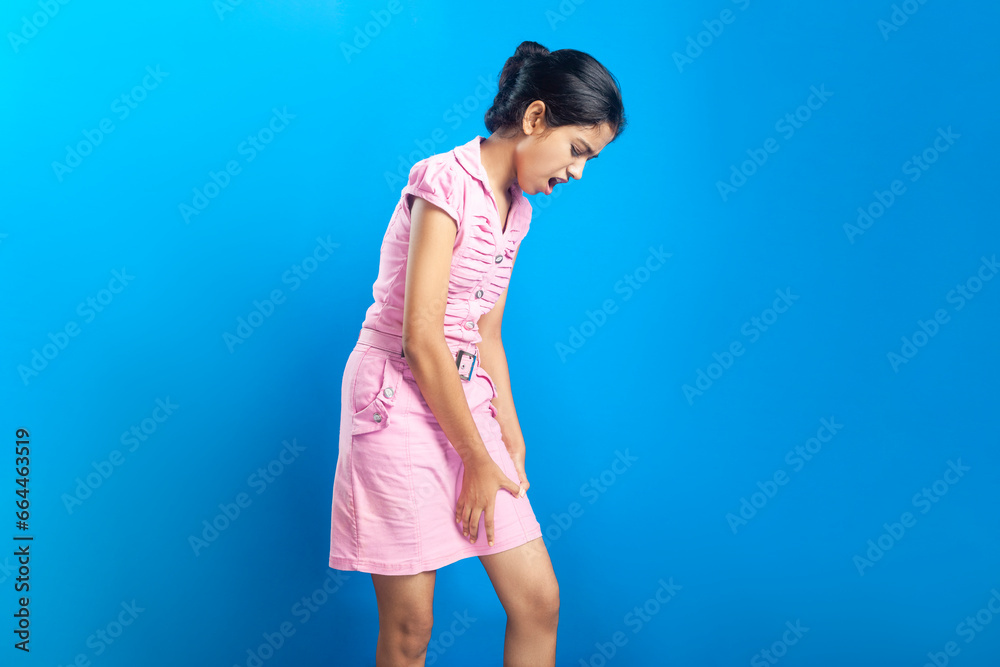 Beautiful Indian girl clutching injured thigh muscle Beautiful Indian girl clutching injured thigh muscle