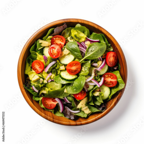 Healthy salad bowl of fresh vegetables, avocado tomato cucumber. overhead view on a plain background