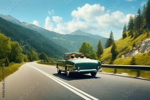 A summer day in a beautiful convertible on a winding road. © Nicole