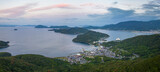 Sunrise color in sky over coastal islands and small village on Shodoshima