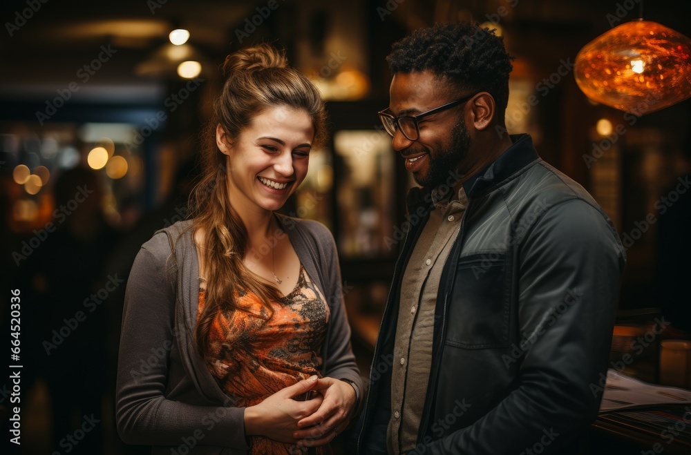 A young diverse couple enjoying a conversation at a café A young diverse couple enjoying a conversation at a café