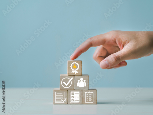 Certificate icon on wooden cube, and quality certification concept, International Organization for Standardization ISO, symbol of leading service quality assurance