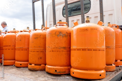 Orange Butane and Propane Cylinders Ready for Delivery photo