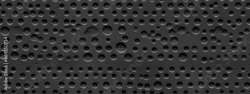Seamless perforated black leather background texture. Tileable trendy elegant dark grey leatherette with pierced holes. Luxury steering wheel or auto seat upholstery material pattern photo