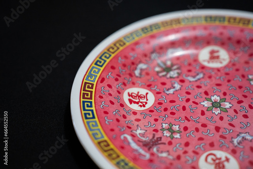 Red Traditional Chinese Plate in Indonesia. Piring merah chinese. (Top view)