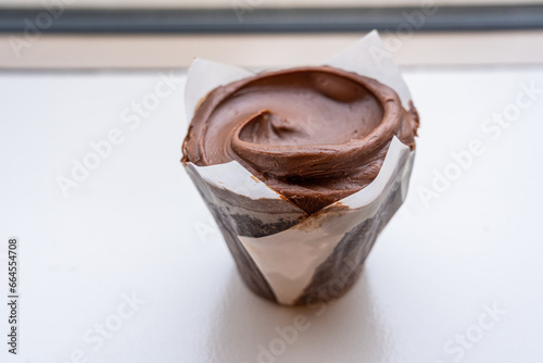 Closeup double chocolate cupcake, the chocolate frosting over chocolate cupcake.
