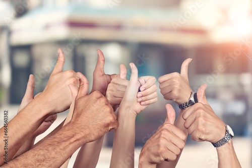 Thumbs up, human hands team together