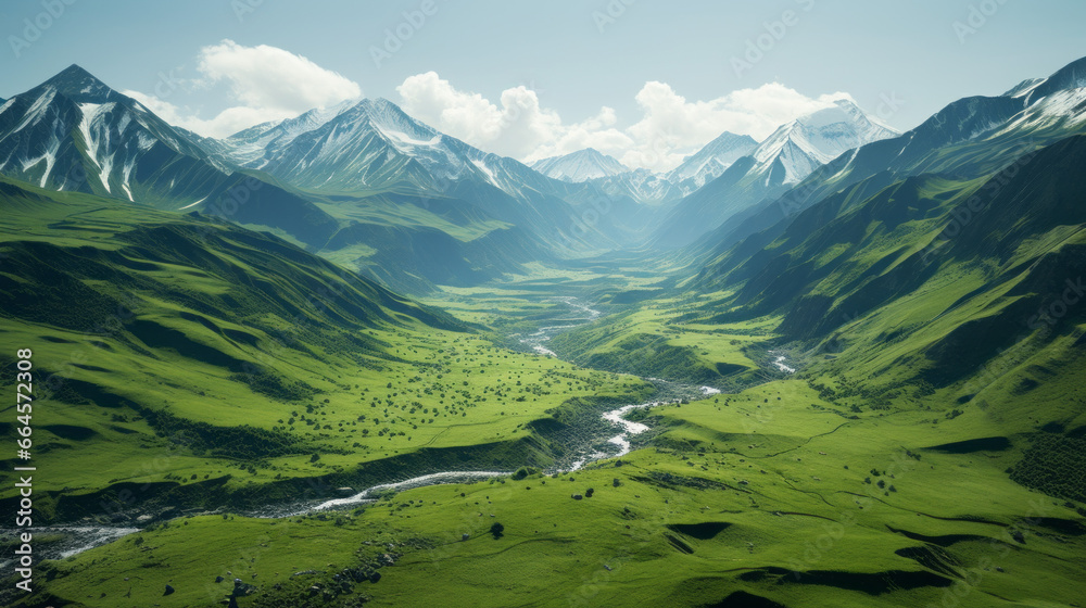 A deep green valley surrounded by snow-capped peaks