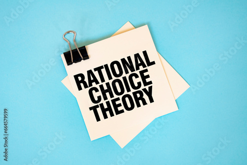 Text RATIONAL CHOICE THEORY on sticky notes with copy space and paper clip isolated on red background.
