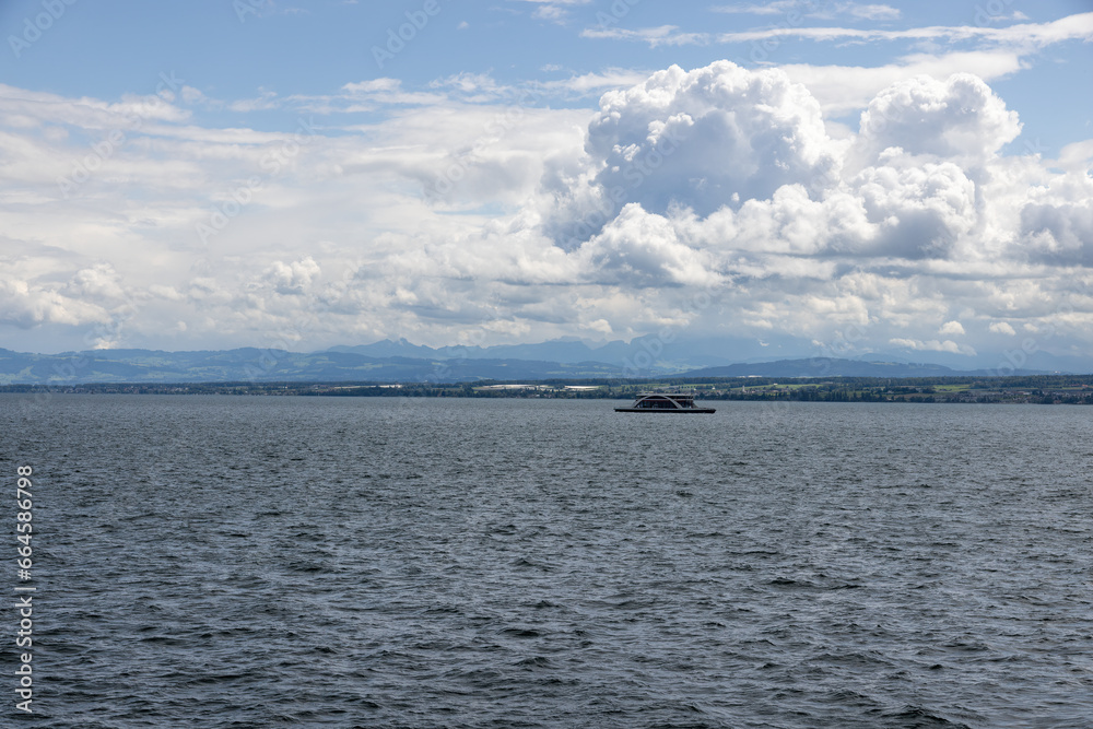 Lake Constance with car ferry in Konstanz with a view of the Alps
