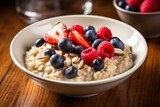 A healthy breakfast dish consisting of a warm bowl of oatmeal topped with fresh berries and a sprinkling of nuts. Generative AI
