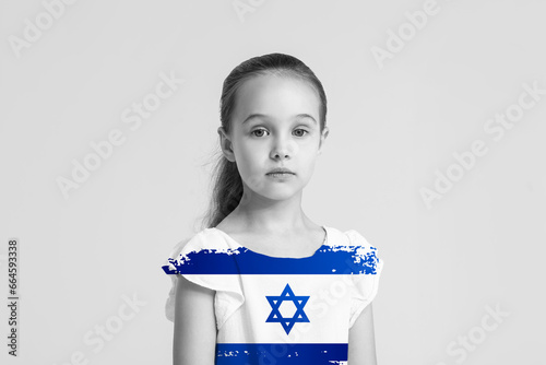 Portrait of cute little girl in yellow blouse on white background photo