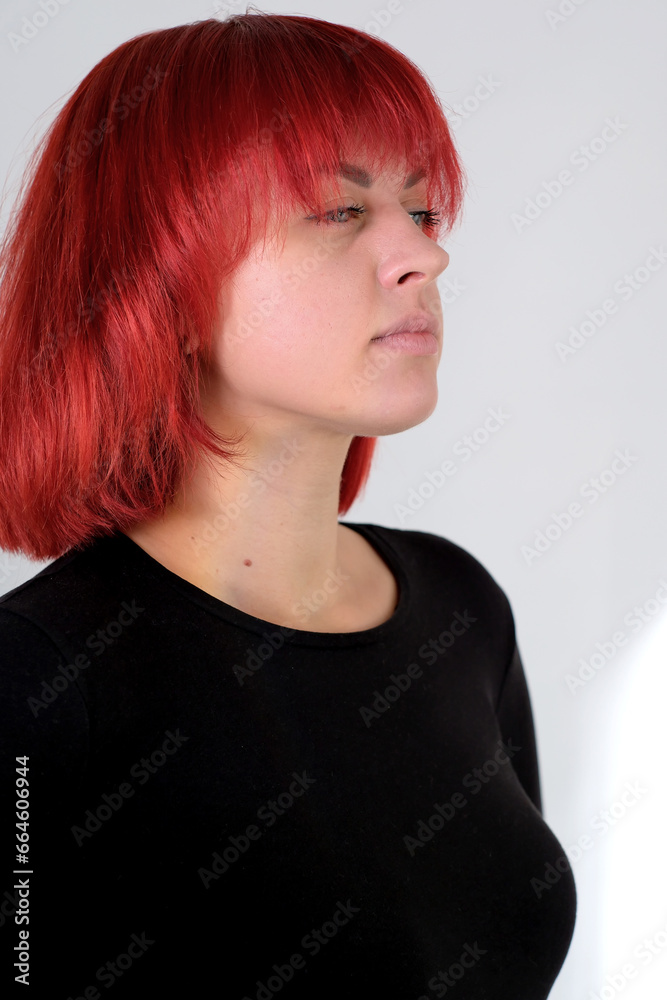 A young attractive woman with a short orange hairstyle A young attractive woman with a short orange hairstyle