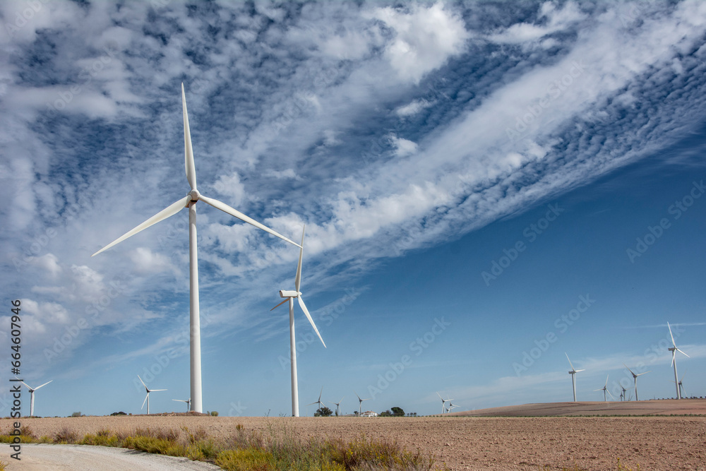 Wind turbines with blue sky background with clouds