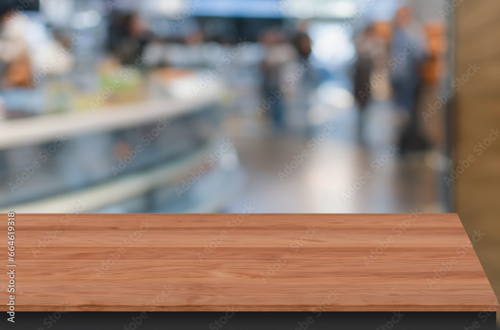 Photo of empty wooden table, where you can add your cup of coffee or some decoration. Focus on the table and blur on the background. 