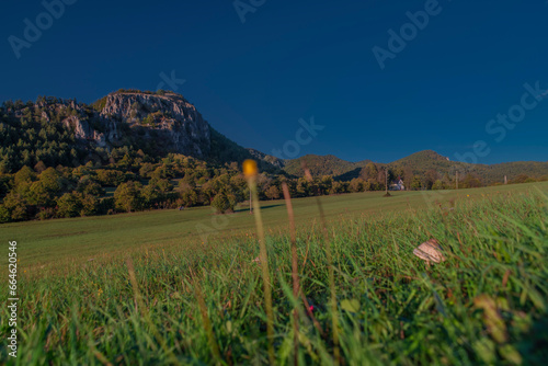 Mysiaca diera hill and rocks over Podskalie village in autumn evening photo