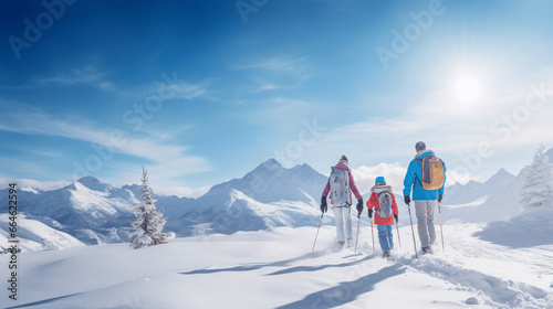 Couple of hikers with backpacks walking in the snowy mountains. © Argun Stock Photos