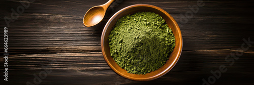 green tea, matcha, wheatgrass powder in wooden bowl.  photo