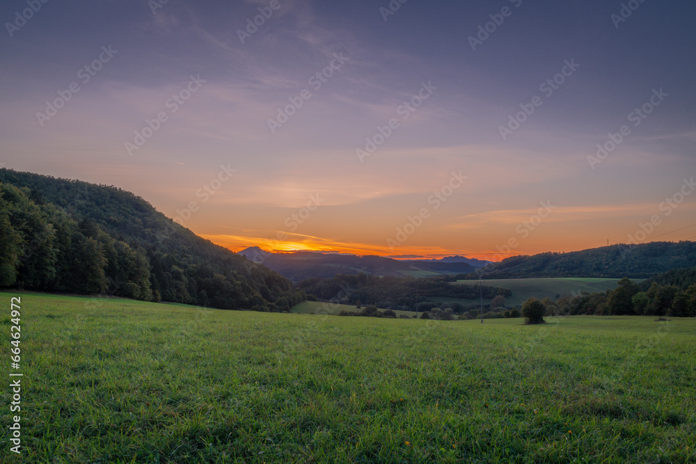 Meadows and hills in Strazovske hills in autumn evening near Podskalie village