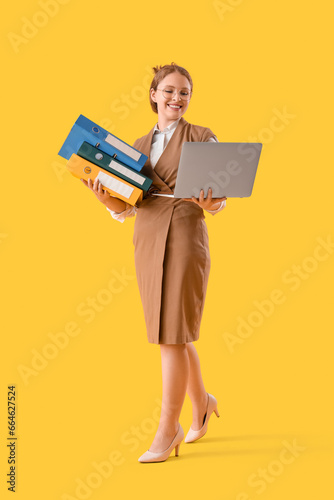 Young businesswoman with do...