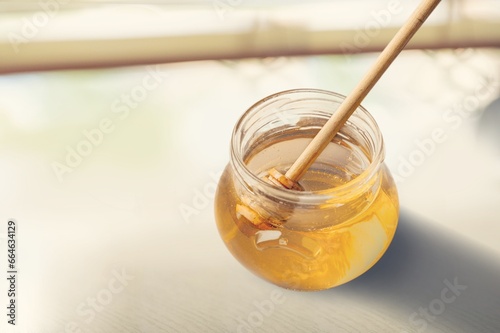 Tasty sweet honey with wood dipper