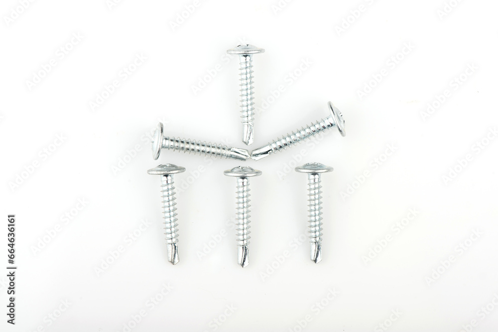 Zinc screws with a round press washer on a white background. Detailed shot of fittings and fasteners. Zinc screws with a round press washer on a white background. Detailed shot of fittings and fasteners.