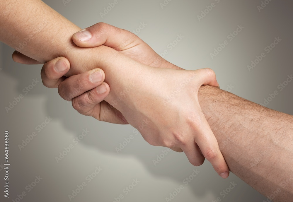 Two hands hold each other, need of help Two hands hold each other, need of help