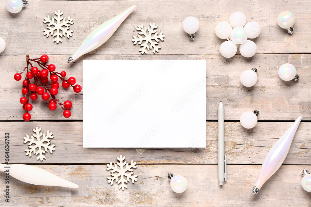 Blank Christmas card with viburnum and decor on grey wooden background Blank Christmas card with viburnum and decor on grey wooden background