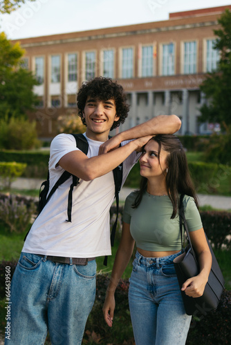 Pair of university students joking and laughing together 