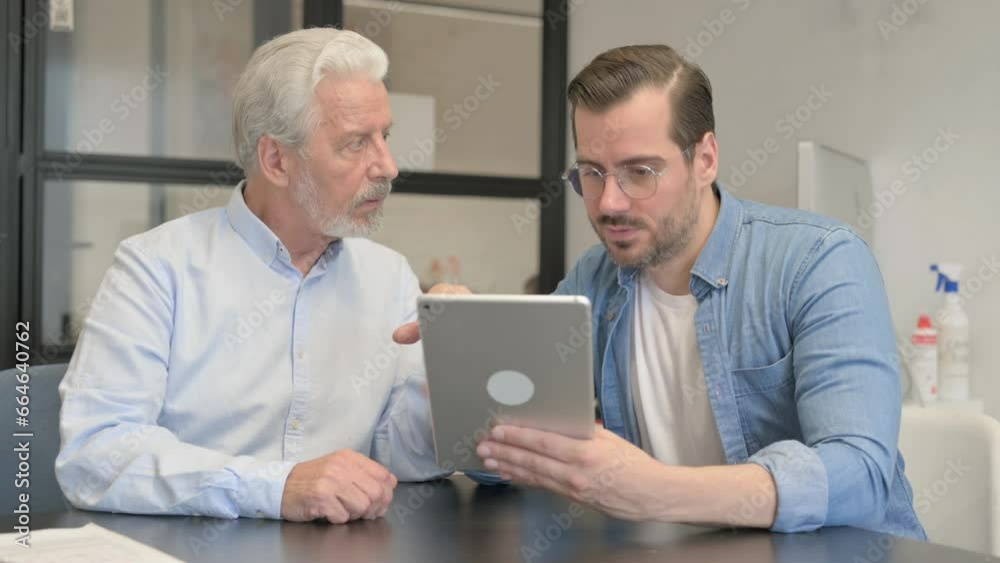 Casual People Discussing Project on Digital Tablet Casual People Discussing Project on Digital Tablet