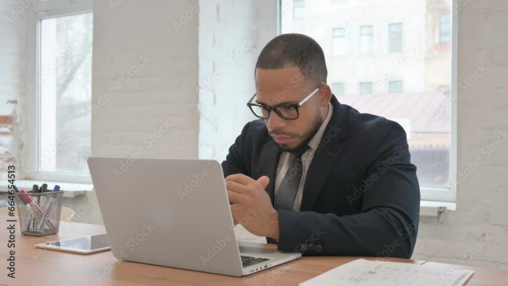 Pensive Mixed Race Businessman Working on Laptop Pensive Mixed Race Businessman Working on Laptop