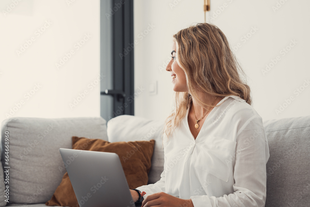 Portrait of one young attractive blonde woman using laptop pc computer on couch relaxing surfing the net at home looking at the window waiting package. Portrait of one young attractive blonde woman using laptop pc computer on couch relaxing surfing the net at home looking at the window waiting package.