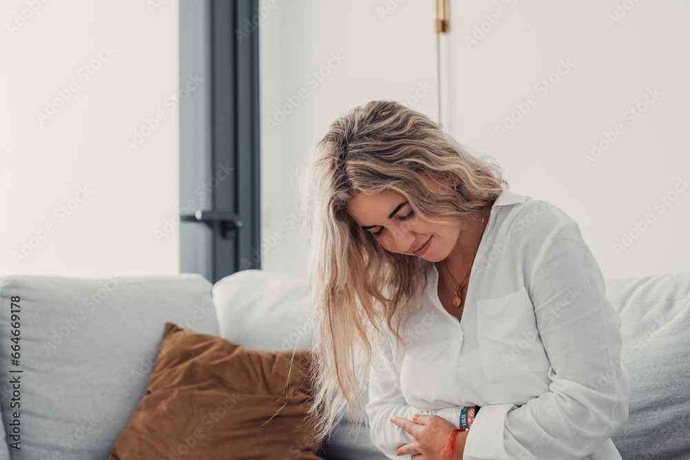 Sick young woman in pain holding belly stomach feeling hurt abdomen ache gastritis pancreatitis symptoms or diarrhea, upset teen girl suffering from indigestion flatulence abdominal problem concept. Sick young woman in pain holding belly stomach feeling hurt abdomen ache gastritis pancreatitis symptoms or diarrhea, upset teen girl suffering from indigestion flatulence abdominal problem concept.