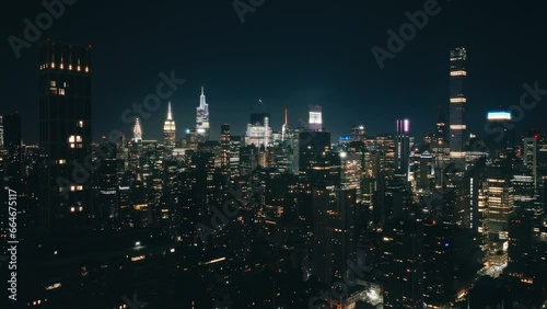 Wallpaper Mural Aerial illuminated at night flight over New York City downtown. Cinematic aerial panorama NYC buildings skyline night downtown. Futuristic megapolis city East Coast.USA urban travel concept background Torontodigital.ca