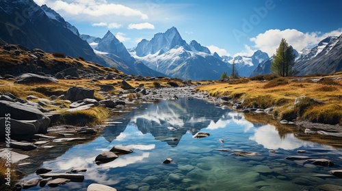 The tranquil beauty of a remote mountain lake  nestled high in the fold mountains  with reflections of the surrounding peaks in its mirror-like surface.