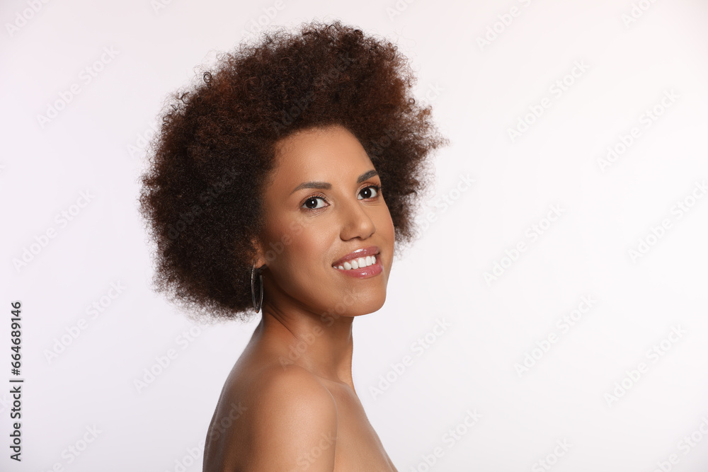 Portrait of beautiful young woman with glamorous makeup on white background. Space for text Portrait of beautiful young woman with glamorous makeup on white background. Space for text