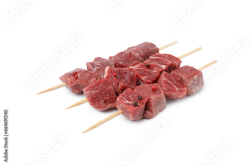 Wooden skewers with cut fresh beef meat isolated on white