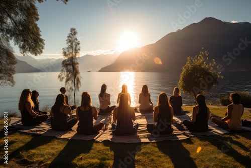 Yoga retreat, group session by the serene lakeside, harmony and balance. photo