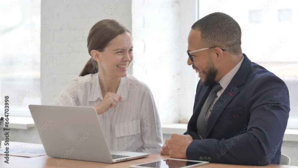 Multi Ethnic Business People Celebrating Online Success in Office Multi Ethnic Business People Celebrating Online Success in Office