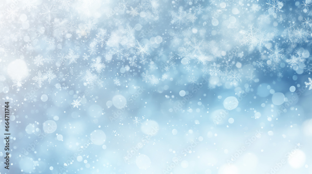 Abstract blue wintery christmas background with sparkling snowflakes and light bokeh