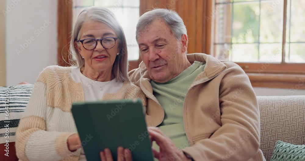 Tablet, conversation and senior couple on sofa in the living room networking on social media. Digital technology, bonding and elderly people in retirement scroll on mobile app or the internet at home Tablet, conversation and senior couple on sofa in the living room networking on social media. Digital technology, bonding and elderly people in retirement scroll on mobile app or the internet at home
