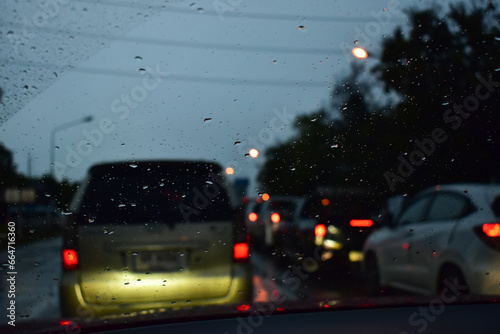 traffic jam on the road in night with rain, defocused background