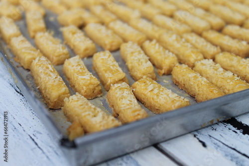 Rows of Indonesian cakes called kastangel on a table ready to serve photo