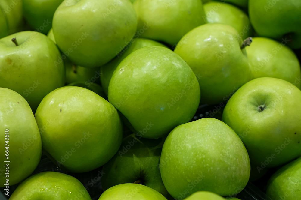 Bunch of green apples in supermarket 