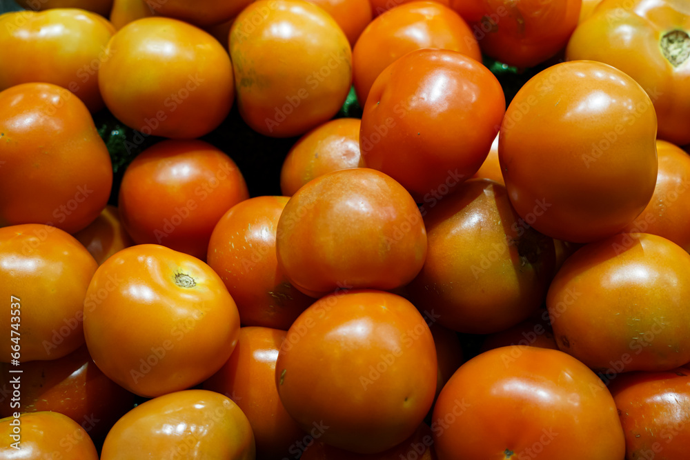 Close-up view of fresh juicy tomatoes in a supermarket. Close-up view of fresh juicy tomatoes in a supermarket.