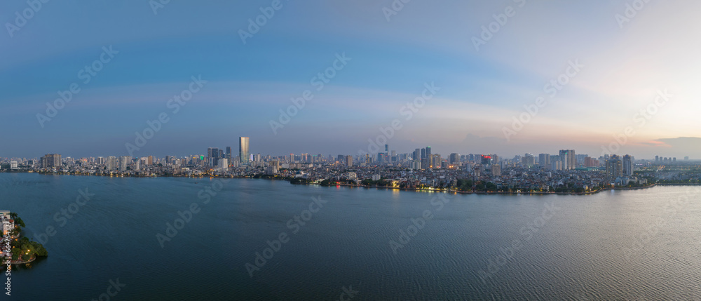 Hanoi skyline cityscape in Ho Tay West Lake with lake and city buildings